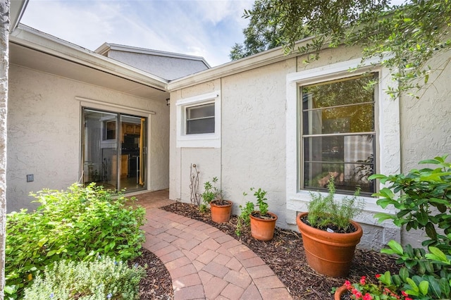7755 High Pine Rd, Orlando, FL 32819 - property entrance featuring stucco siding
