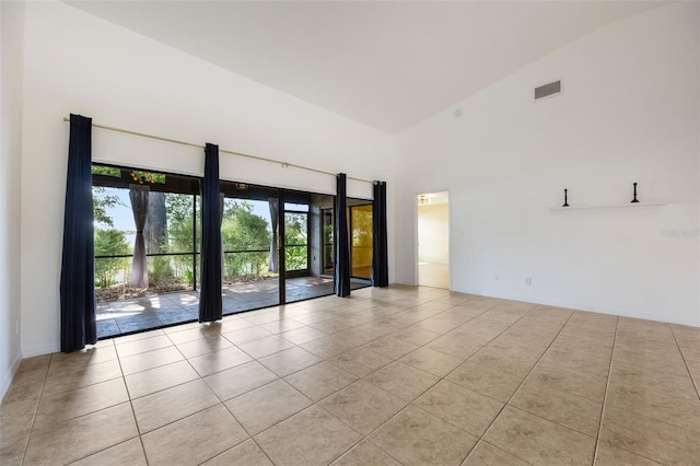 7755 High Pine Rd, Orlando, FL 32819 - empty room with high vaulted ceiling and light tile patterned floors