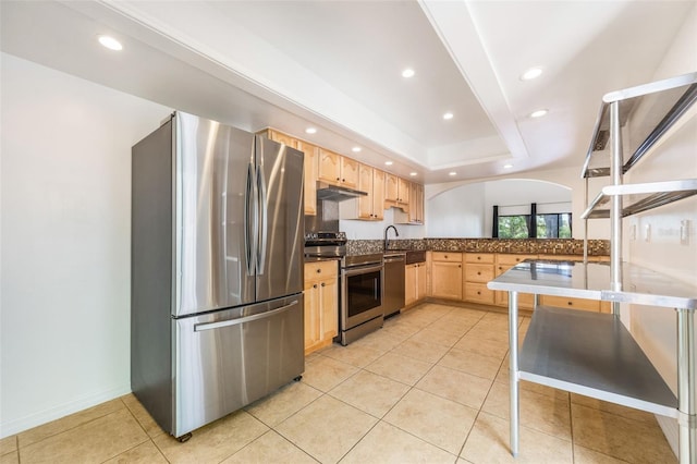 7755 High Pine Rd, Orlando, FL 32819 - kitchen featuring stainless steel appliances, light brown cabinets, under cabinet range hood, recessed lighting, and light tile patterned floors