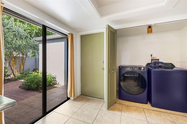7755 High Pine Rd, Orlando, FL 32819 - laundry room with independent washer and dryer and light tile patterned floors