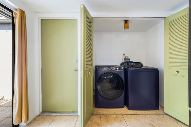 7755 High Pine Rd, Orlando, FL 32819 - washroom featuring separate washer and dryer and light tile patterned flooring