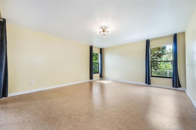 7755 High Pine Rd, Orlando, FL 32819 - unfurnished room featuring a textured ceiling