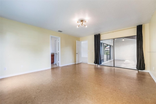 7755 High Pine Rd, Orlando, FL 32819 - empty room with baseboards and a chandelier