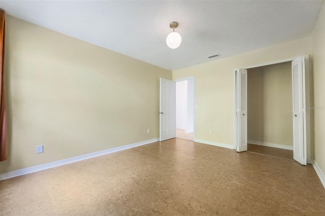7755 High Pine Rd, Orlando, FL 32819 - spare room featuring baseboards
