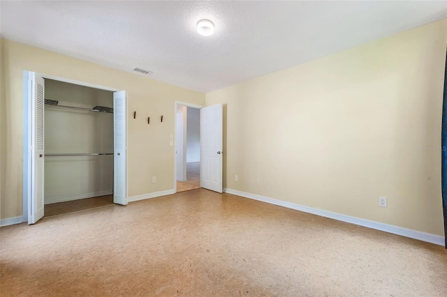 7755 High Pine Rd, Orlando, FL 32819 - unfurnished bedroom with baseboards and a closet