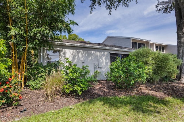 7755 High Pine Rd, Orlando, FL 32819 - view of side of property with stucco siding