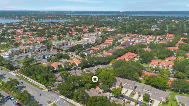 7755 High Pine Rd, Orlando, FL 32819 - aerial view of property and surrounding area with a large body of water and nearby suburban area