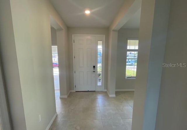 1940 Goblet Cove St, Kissimmee, FL 34746 - entryway featuring baseboards and light tile patterned floors