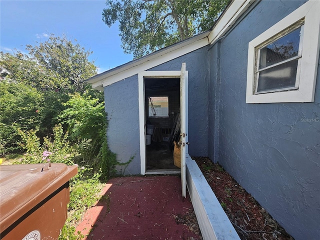 115 N 10th St, Haines City, FL 33844 - entrance to property featuring stucco siding