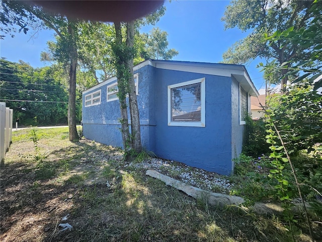 115 N 10th St, Haines City, FL 33844 - view of property exterior featuring stucco siding