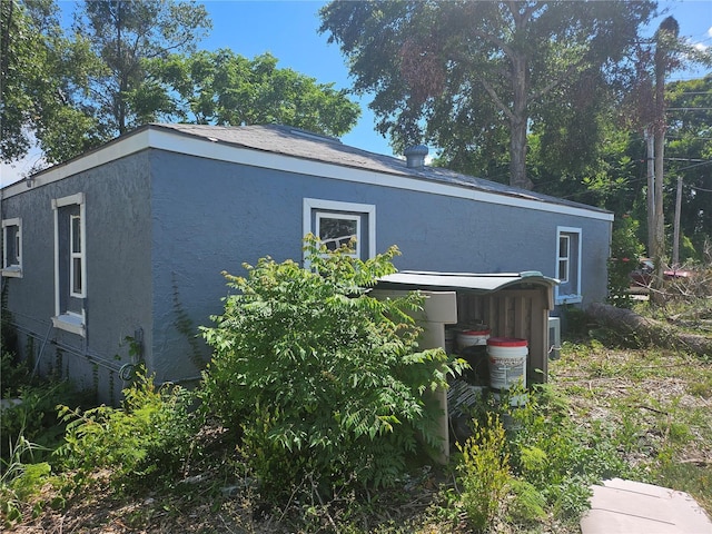 115 N 10th St, Haines City, FL 33844 - view of property exterior with stucco siding