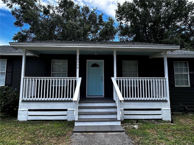 3304 Dew Berry Ave, Apopka, FL 32712 - view of front facade featuring a porch and roof with shingles
