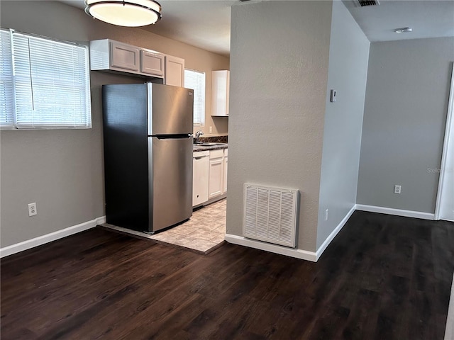 3304 Dew Berry Ave, Apopka, FL 32712 - kitchen with appliances with stainless steel finishes, wood finished floors, and dark countertops