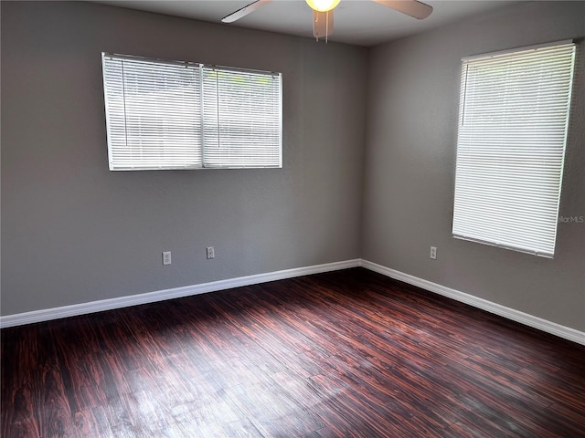 3304 Dew Berry Ave, Apopka, FL 32712 - empty room featuring a ceiling fan, dark wood-style flooring, and plenty of natural light