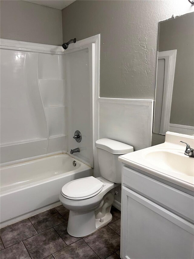 3304 Dew Berry Ave, Apopka, FL 32712 - full bathroom featuring vanity, shower / bathtub combination, tile patterned floors, and a textured wall