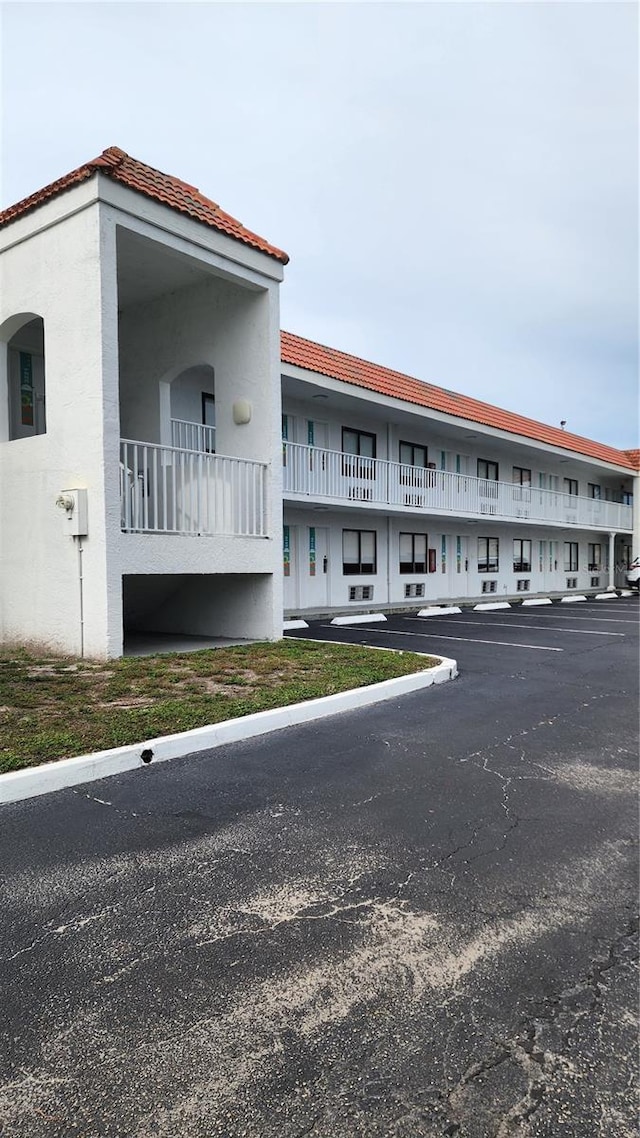 5367 W Irlo Bronson Memorial Hwy Unit 3-216, Kissimmee, FL 34746 - view of building exterior with uncovered parking