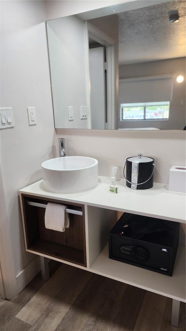 5367 W Irlo Bronson Memorial Hwy Unit 1-108, Kissimmee, FL 34746 - bathroom featuring wood finished floors and vanity