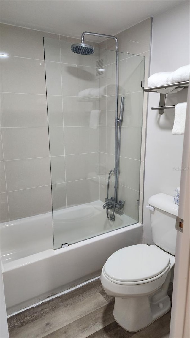 5367 W Irlo Bronson Memorial Hwy Unit 1-108, Kissimmee, FL 34746 - bathroom featuring  shower combination and wood finished floors