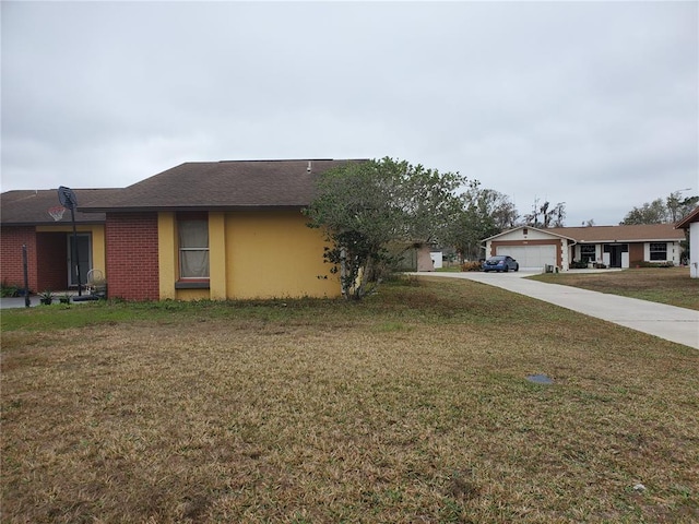 exterior space with a front yard and a garage