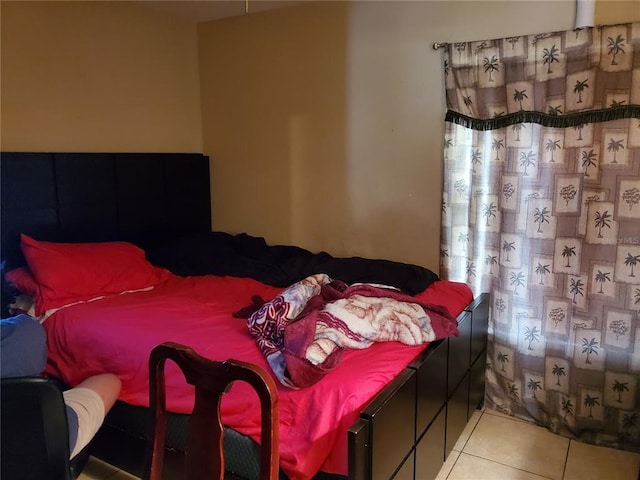 bedroom with light tile floors