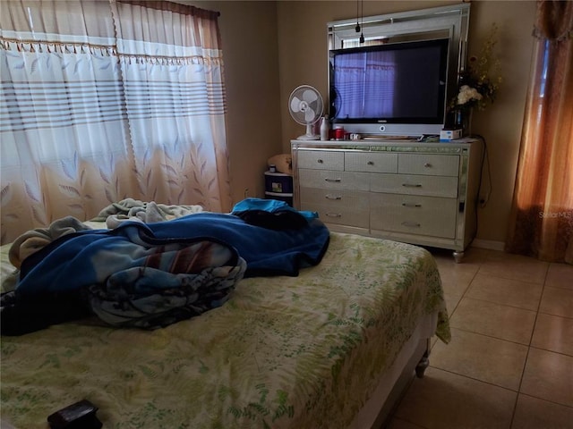 bedroom featuring light tile floors