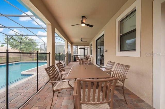 exterior space with ceiling fan