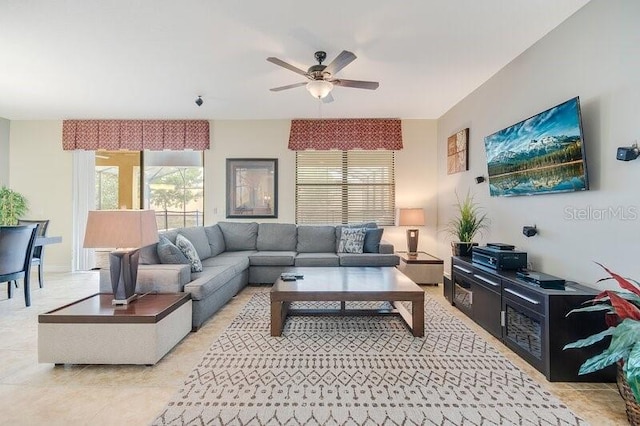 tiled living room with ceiling fan