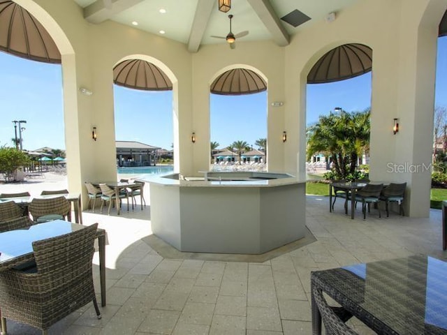 view of patio / terrace featuring a bar and a water view