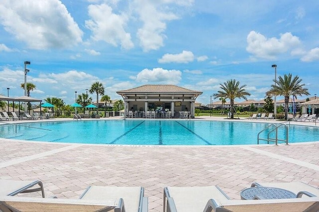 view of pool featuring a patio area