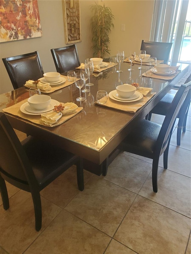 dining space with tile patterned flooring