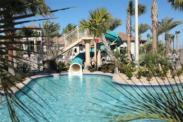 view of pool with a water slide