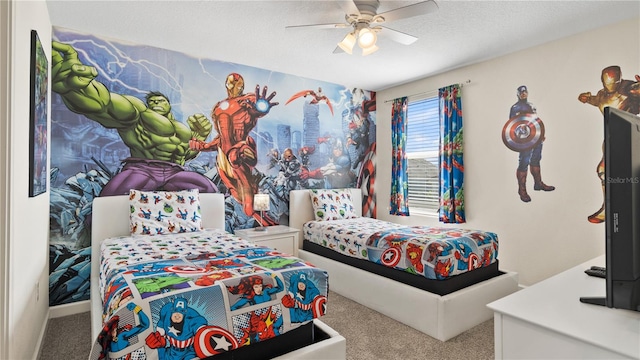 carpeted bedroom with ceiling fan and a textured ceiling