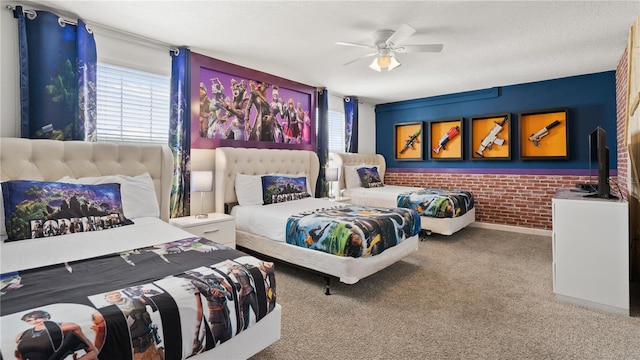 carpeted bedroom featuring ceiling fan and a textured ceiling