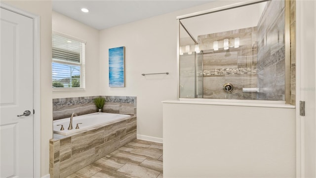 bathroom with separate shower and tub and tile patterned floors