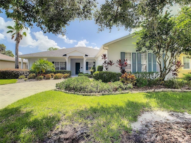 single story home featuring a front yard