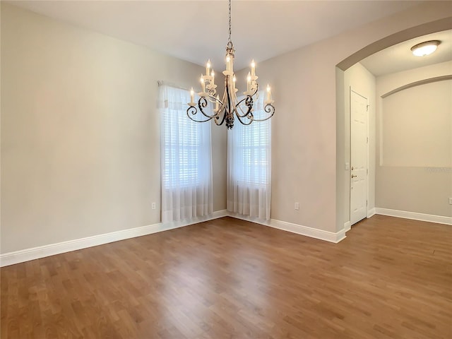 unfurnished dining area with dark hardwood / wood-style floors