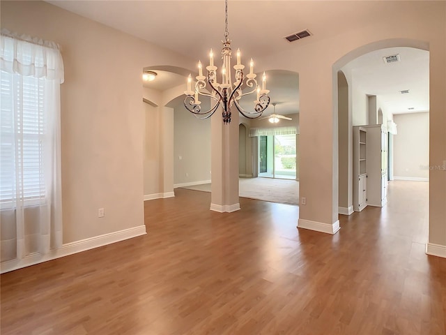 unfurnished dining area featuring dark wood-type flooring