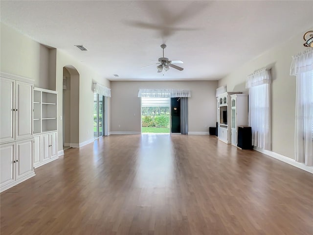 unfurnished living room with hardwood / wood-style floors and ceiling fan