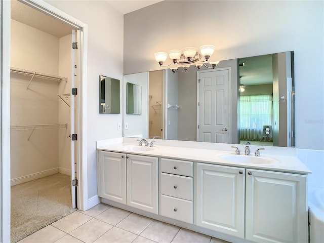 bathroom with tile patterned floors and vanity