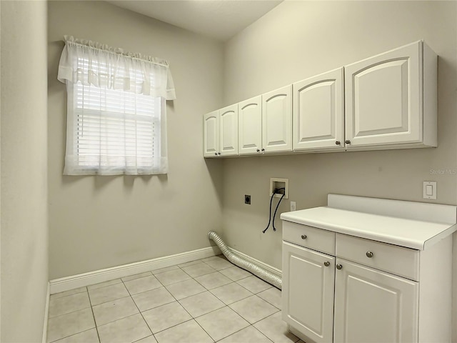 laundry room featuring cabinets, washer hookup, hookup for an electric dryer, and light tile patterned floors