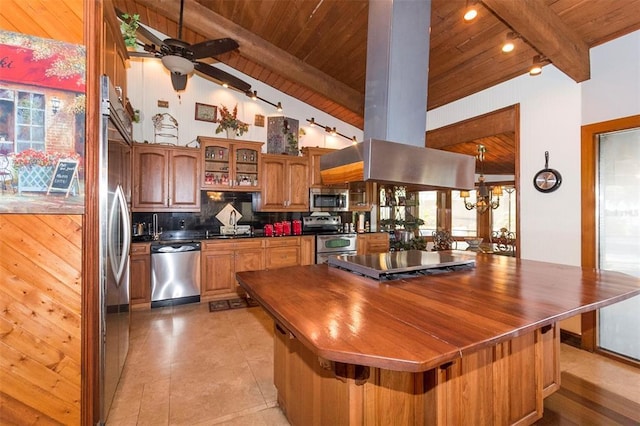 kitchen featuring ceiling fan, wood ceiling, beamed ceiling, appliances with stainless steel finishes, and backsplash