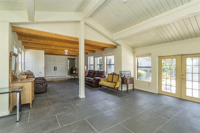 sunroom / solarium featuring french doors, ceiling fan, and vaulted ceiling with beams