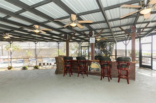 sunroom / solarium featuring ceiling fan