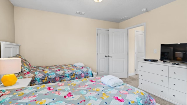 carpeted bedroom with a closet