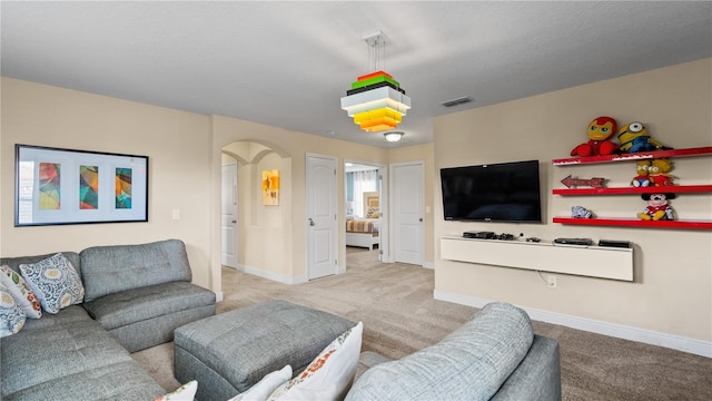 living room featuring light carpet