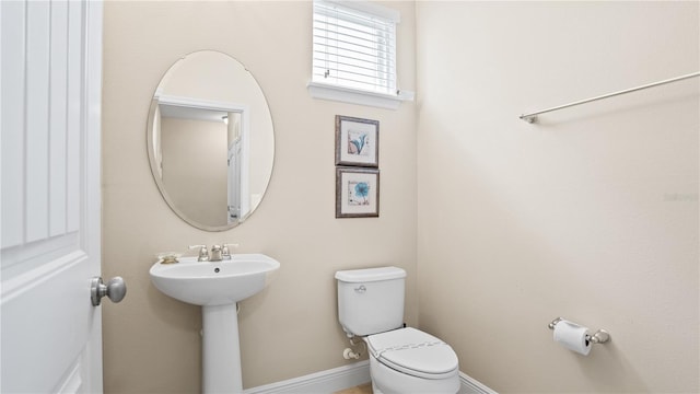 bathroom featuring sink and toilet