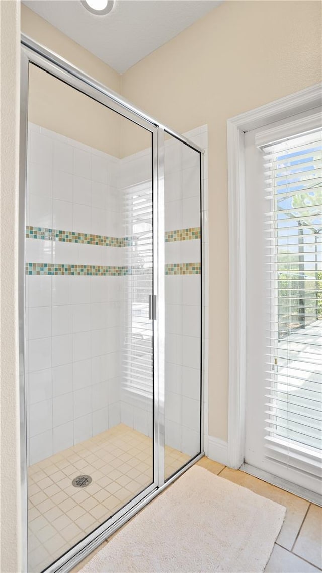 bathroom featuring tile patterned floors and walk in shower