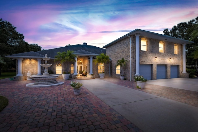 view of front of property with a garage