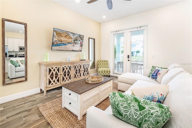 living room featuring ceiling fan and french doors