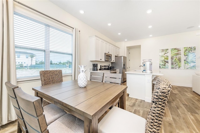 dining space with plenty of natural light and sink